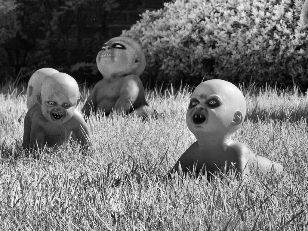 Monster babies crawl in the grass