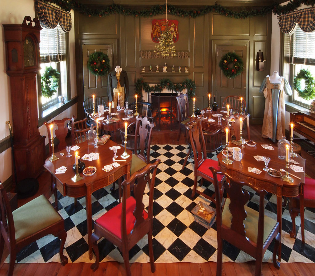 Candle lit Christmas gaming room at the historic Wilson-Warner House