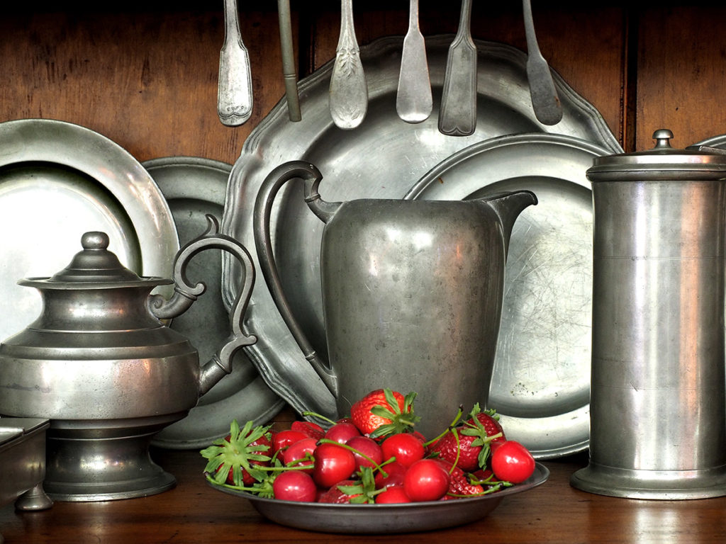 18th-century pewter pitcher, teapot and plates.