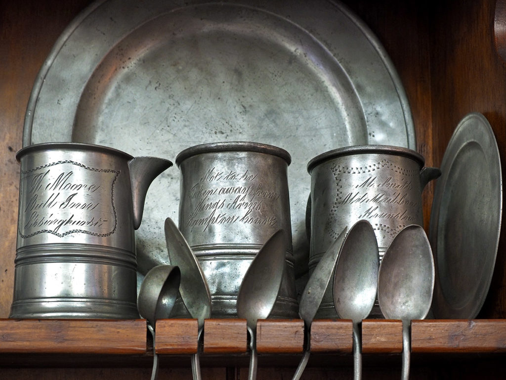 18th-century pewter pitcher, mugs and plates